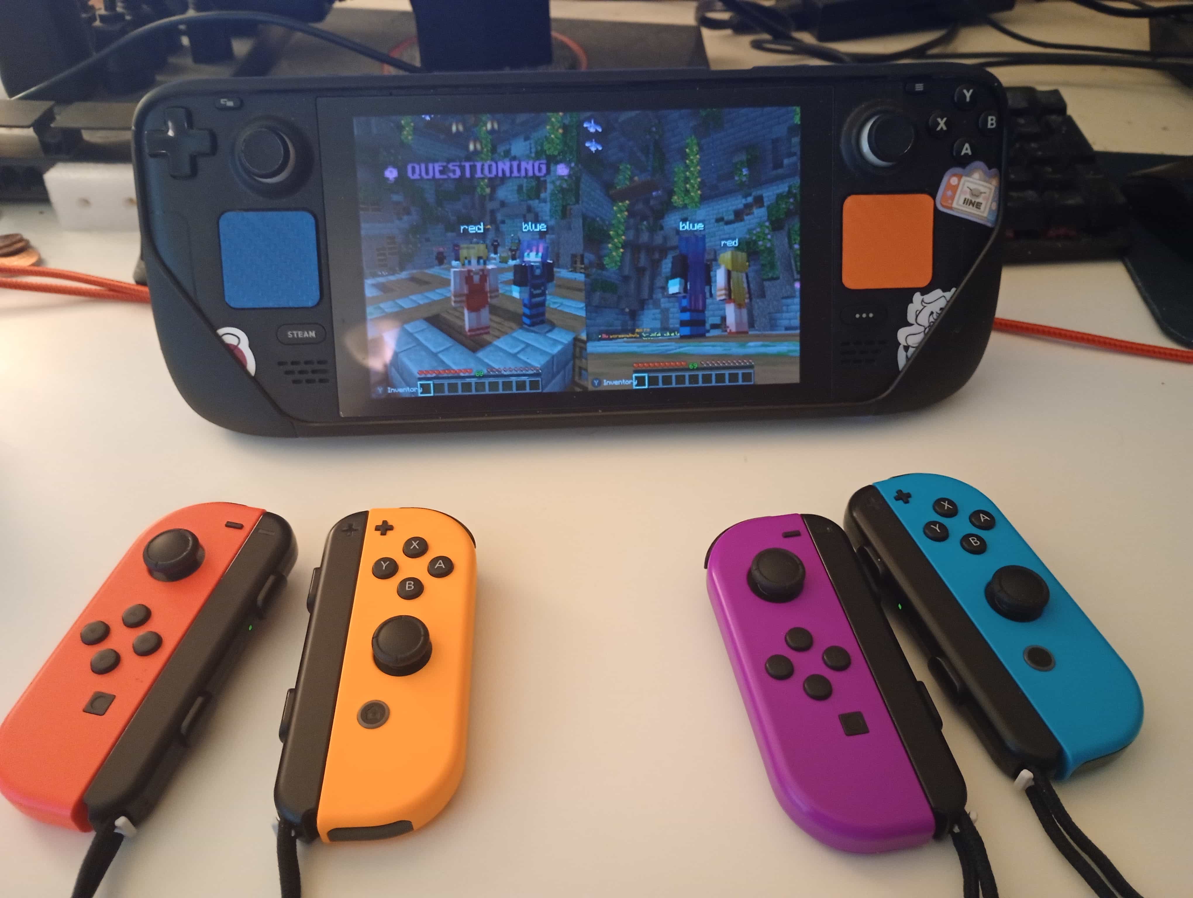 Minecraft running in splitscreen on a Steam Deck, with two pairs of Nintendo Joy-Cons as the controllers.